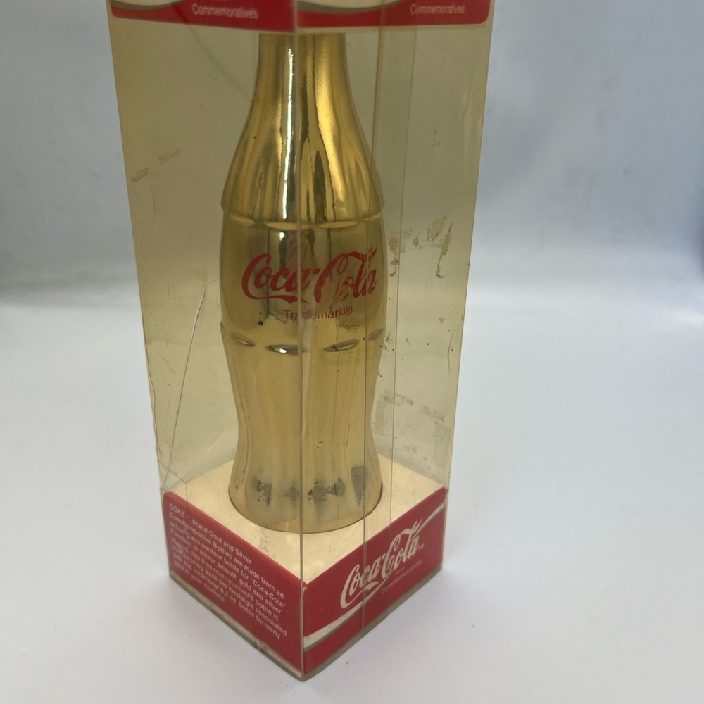 Coca-Cola Gold and Red Metallic Commemorative Bottle